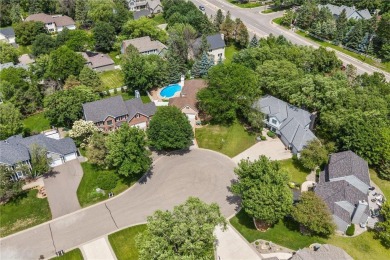 Nestled in a private cul-de-sac across from Prestwick Golf Club on Prestwick Golf Club At Wedgewood in Minnesota - for sale on GolfHomes.com, golf home, golf lot