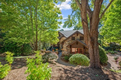 Breathtaking views of Lake Keowee's only waterfall frame this on The Cliffs At Keowee Falls in South Carolina - for sale on GolfHomes.com, golf home, golf lot
