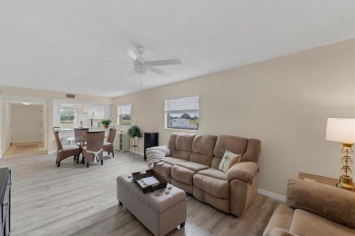 Step inside this beautiful END UNIT to be greeted by neutral on Capri Isle Golf Club in Florida - for sale on GolfHomes.com, golf home, golf lot