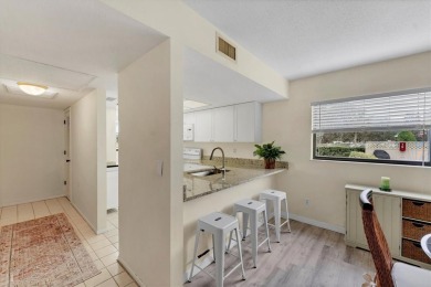 Step inside this beautiful END UNIT to be greeted by neutral on Capri Isle Golf Club in Florida - for sale on GolfHomes.com, golf home, golf lot