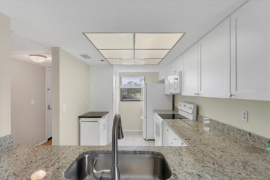 Step inside this beautiful END UNIT to be greeted by neutral on Capri Isle Golf Club in Florida - for sale on GolfHomes.com, golf home, golf lot