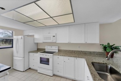 Step inside this beautiful END UNIT to be greeted by neutral on Capri Isle Golf Club in Florida - for sale on GolfHomes.com, golf home, golf lot