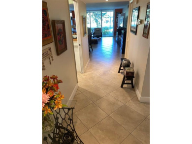 Fantastic corner garden apartment located on the ground floor on Oaks Country Club in Florida - for sale on GolfHomes.com, golf home, golf lot