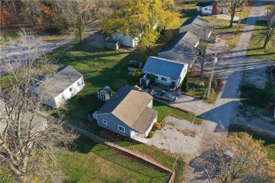 Renovated cottage is located in the heart of Geneva on the Lake on Geneva On The Lake Municipal Golf Course in Ohio - for sale on GolfHomes.com, golf home, golf lot