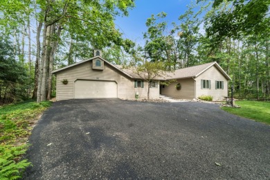 Enjoy sweeping golf course views and your own personal cart path on Gaylord Country Club in Michigan - for sale on GolfHomes.com, golf home, golf lot