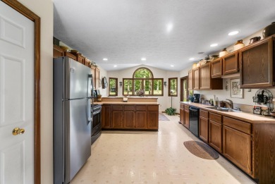 Enjoy sweeping golf course views and your own personal cart path on Gaylord Country Club in Michigan - for sale on GolfHomes.com, golf home, golf lot