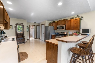 Enjoy sweeping golf course views and your own personal cart path on Gaylord Country Club in Michigan - for sale on GolfHomes.com, golf home, golf lot