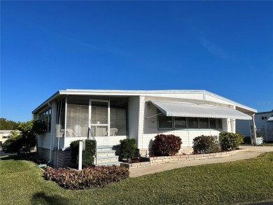 Home is located on a lovely spacious corner lot!  This home has on Mangrove Bay Golf Course in Florida - for sale on GolfHomes.com, golf home, golf lot