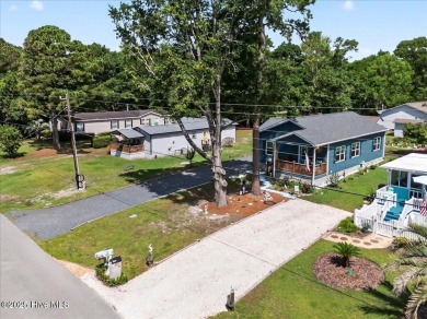 Welcome to 505 Magnolia Drive in peaceful 
Seaside Station. This on Oyster Bay Golf Links in North Carolina - for sale on GolfHomes.com, golf home, golf lot