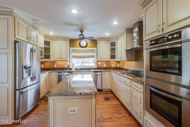 Waterfront 3-bed, 2.5-bath home in Timber Ridge with private on Pass Christian Isles Golf Club in Mississippi - for sale on GolfHomes.com, golf home, golf lot