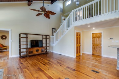 Waterfront 3-bed, 2.5-bath home in Timber Ridge with private on Pass Christian Isles Golf Club in Mississippi - for sale on GolfHomes.com, golf home, golf lot