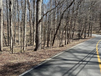 This 2.45 acre lake lot is located in Bent Tree, a gated on Bent Tree Golf Course in Georgia - for sale on GolfHomes.com, golf home, golf lot