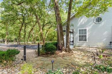 Southern charm meets this 3BR 2BA  Cape Cod style cottage tucked on Holly Lake Ranch Golf Club in Texas - for sale on GolfHomes.com, golf home, golf lot