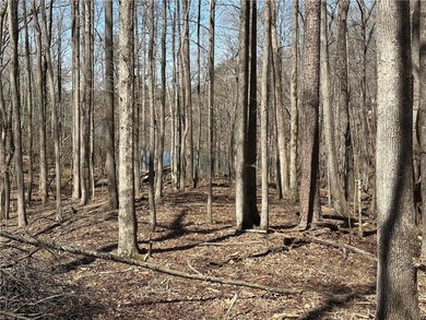 This 2.45 acre lake lot is located in Bent Tree, a gated on Bent Tree Golf Course in Georgia - for sale on GolfHomes.com, golf home, golf lot