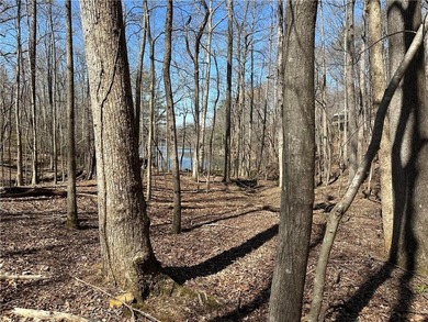 This 2.45 acre lake lot is located in Bent Tree, a gated on Bent Tree Golf Course in Georgia - for sale on GolfHomes.com, golf home, golf lot