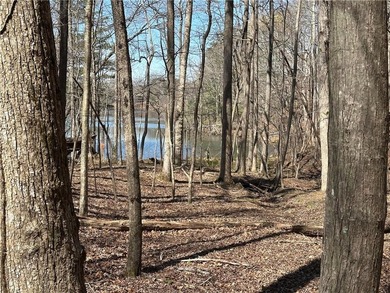 This 2.45 acre lake lot is located in Bent Tree, a gated on Bent Tree Golf Course in Georgia - for sale on GolfHomes.com, golf home, golf lot