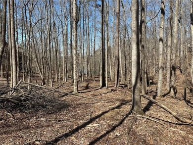 This 2.45 acre lake lot is located in Bent Tree, a gated on Bent Tree Golf Course in Georgia - for sale on GolfHomes.com, golf home, golf lot