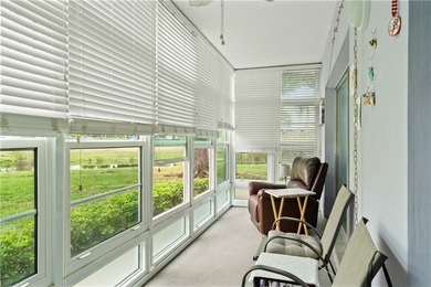 A rare gem! This 1st-floor end-unit sits in a unique Non-55+ on The American Golf Club in Florida - for sale on GolfHomes.com, golf home, golf lot