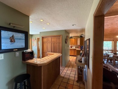 Conveniently located 3 bedrooms, 2 1/2-bathroom cabin in Angel on Angel Fire Resort Country Club in New Mexico - for sale on GolfHomes.com, golf home, golf lot