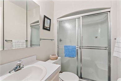 A rare gem! This 1st-floor end-unit sits in a unique Non-55+ on The American Golf Club in Florida - for sale on GolfHomes.com, golf home, golf lot