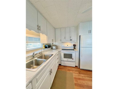 This beautifully updated two-bedroom, two-bath home offers the on Fairway Village Golf Course in Florida - for sale on GolfHomes.com, golf home, golf lot