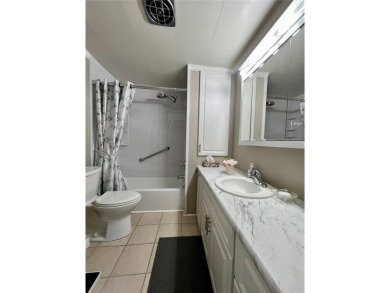 This beautifully updated two-bedroom, two-bath home offers the on Fairway Village Golf Course in Florida - for sale on GolfHomes.com, golf home, golf lot