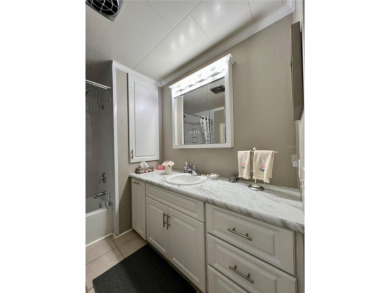 This beautifully updated two-bedroom, two-bath home offers the on Fairway Village Golf Course in Florida - for sale on GolfHomes.com, golf home, golf lot