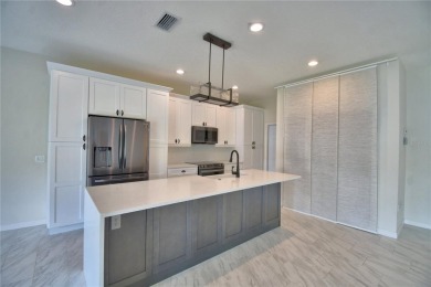 Welcome to this beautifully updated 2-bedroom, 2-bathroom home on Lake Ashton Golf Club in Florida - for sale on GolfHomes.com, golf home, golf lot