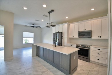 Welcome to this beautifully updated 2-bedroom, 2-bathroom home on Lake Ashton Golf Club in Florida - for sale on GolfHomes.com, golf home, golf lot