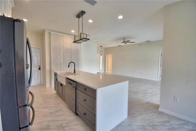 Welcome to this beautifully updated 2-bedroom, 2-bathroom home on Lake Ashton Golf Club in Florida - for sale on GolfHomes.com, golf home, golf lot