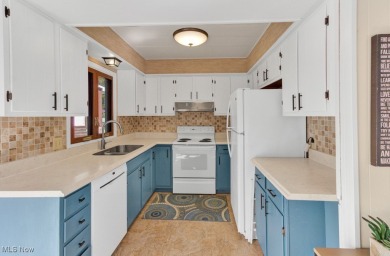 Welcome to your Lake Mohawk retreat! This stylishly remodeled on Lake Mohawk Golf Club in Ohio - for sale on GolfHomes.com, golf home, golf lot