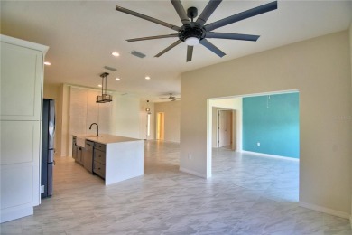 Welcome to this beautifully updated 2-bedroom, 2-bathroom home on Lake Ashton Golf Club in Florida - for sale on GolfHomes.com, golf home, golf lot