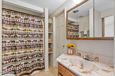 Tucked away on a rare 1/3+ acre homesite backing the dramatic on Pinewood Country Club in Arizona - for sale on GolfHomes.com, golf home, golf lot