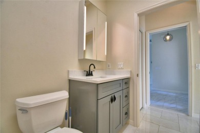 Welcome to this beautifully updated 2-bedroom, 2-bathroom home on Lake Ashton Golf Club in Florida - for sale on GolfHomes.com, golf home, golf lot