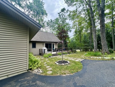 Private northern MI retreat! Renovated 1,428 sq ft chalet on 2 on The Loon Golf Resort in Michigan - for sale on GolfHomes.com, golf home, golf lot