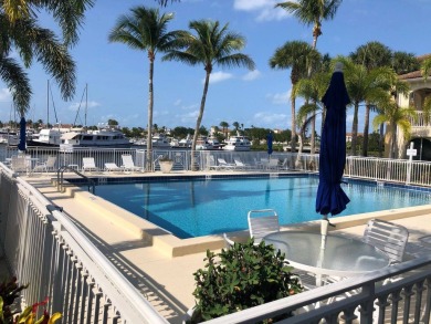 Awesome Marina and Yacht Basin view condo in exclusive, gated on Grand Harbor Golf and Country Club in Florida - for sale on GolfHomes.com, golf home, golf lot