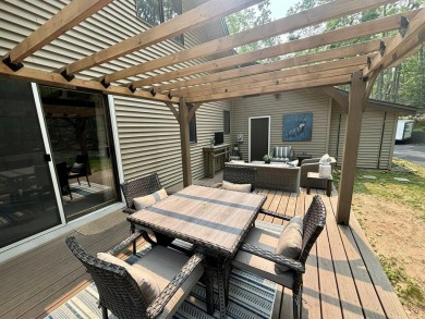 Private northern MI retreat! Renovated 1,428 sq ft chalet on 2 on The Loon Golf Resort in Michigan - for sale on GolfHomes.com, golf home, golf lot