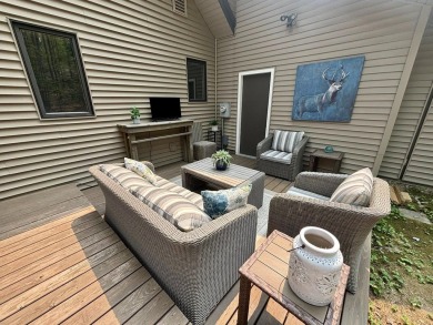 Private northern MI retreat! Renovated 1,428 sq ft chalet on 2 on The Loon Golf Resort in Michigan - for sale on GolfHomes.com, golf home, golf lot