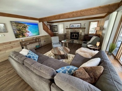 Private northern MI retreat! Renovated 1,428 sq ft chalet on 2 on The Loon Golf Resort in Michigan - for sale on GolfHomes.com, golf home, golf lot