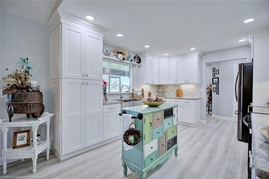 This beautifully remodeled home sits on a double lot with a on  in Florida - for sale on GolfHomes.com, golf home, golf lot