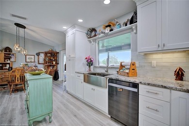 This beautifully remodeled home sits on a double lot with a on  in Florida - for sale on GolfHomes.com, golf home, golf lot