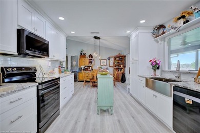 This beautifully remodeled home sits on a double lot with a on  in Florida - for sale on GolfHomes.com, golf home, golf lot