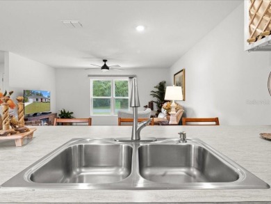 Built in 2023 and thoughtfully upgraded with luxury vinyl plank on Marion Oaks Country Club in Florida - for sale on GolfHomes.com, golf home, golf lot