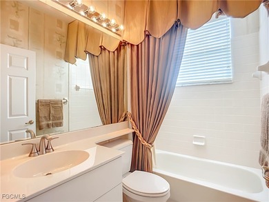 This professionally decorated home in HERONS GLEN COUNTRY CLUB on Herons Glen Golf and Country Club in Florida - for sale on GolfHomes.com, golf home, golf lot