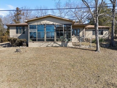 Sprawling lakefront retreat with easy walking access to the on Holiday Island Executive Golf Course in Arkansas - for sale on GolfHomes.com, golf home, golf lot