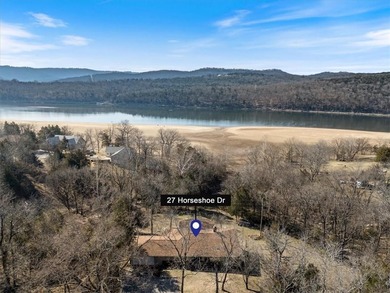Sprawling lakefront retreat with easy walking access to the on Holiday Island Executive Golf Course in Arkansas - for sale on GolfHomes.com, golf home, golf lot