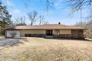 Sprawling lakefront retreat with easy walking access to the on Holiday Island Executive Golf Course in Arkansas - for sale on GolfHomes.com, golf home, golf lot