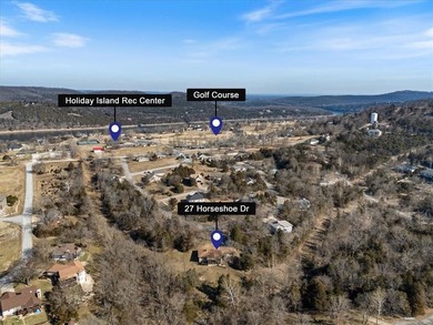 Sprawling lakefront retreat with easy walking access to the on Holiday Island Executive Golf Course in Arkansas - for sale on GolfHomes.com, golf home, golf lot