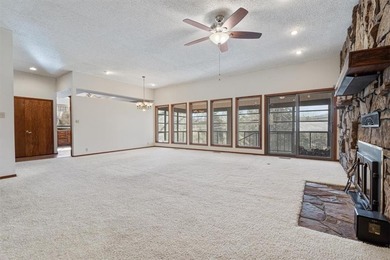 Sprawling lakefront retreat with easy walking access to the on Holiday Island Executive Golf Course in Arkansas - for sale on GolfHomes.com, golf home, golf lot