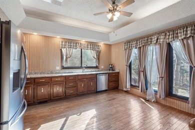 Sprawling lakefront retreat with easy walking access to the on Holiday Island Executive Golf Course in Arkansas - for sale on GolfHomes.com, golf home, golf lot